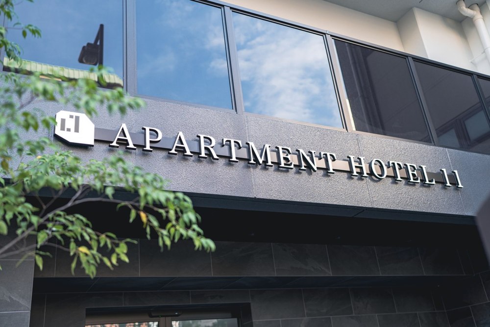 Apartment Hotel 11 entrance and brand sign